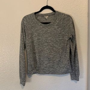 Grey long sleeve shirt.